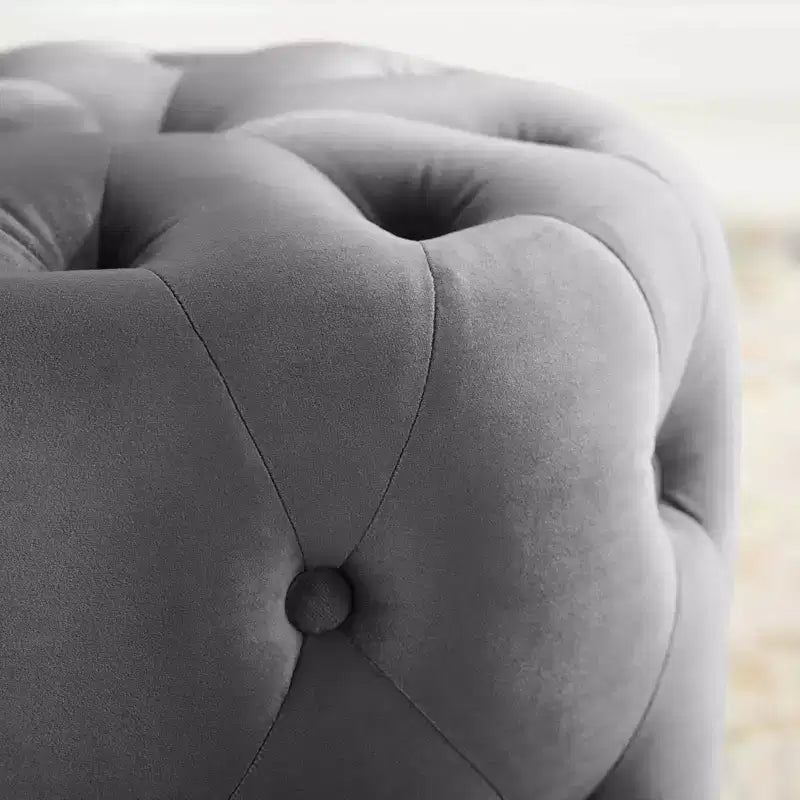 Pouf rond capitonné en velours performance