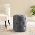 Pouf rond capitonné en velours performance